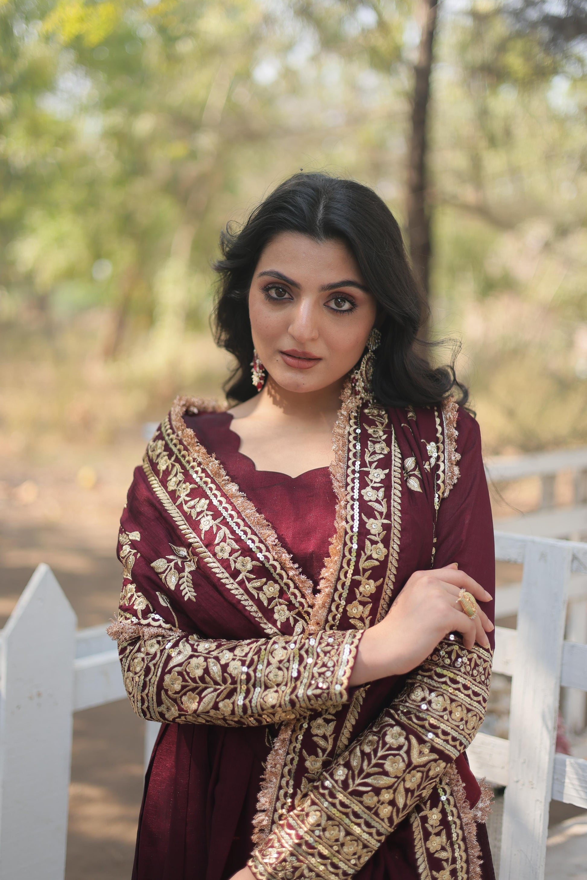 Elegant maroon designer gown for women with intricate embroidery and stylish detailing