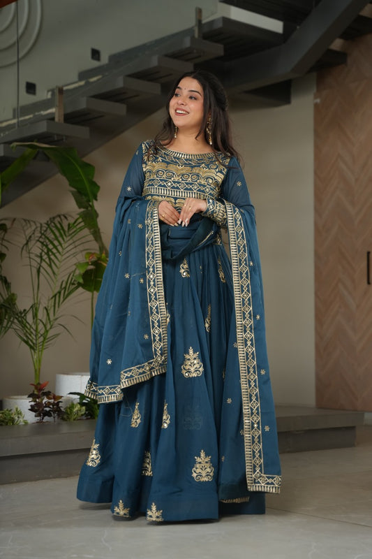 Elegant KN Enterprises embroidered long dress in teal with intricate gold detailing and matching dupatta