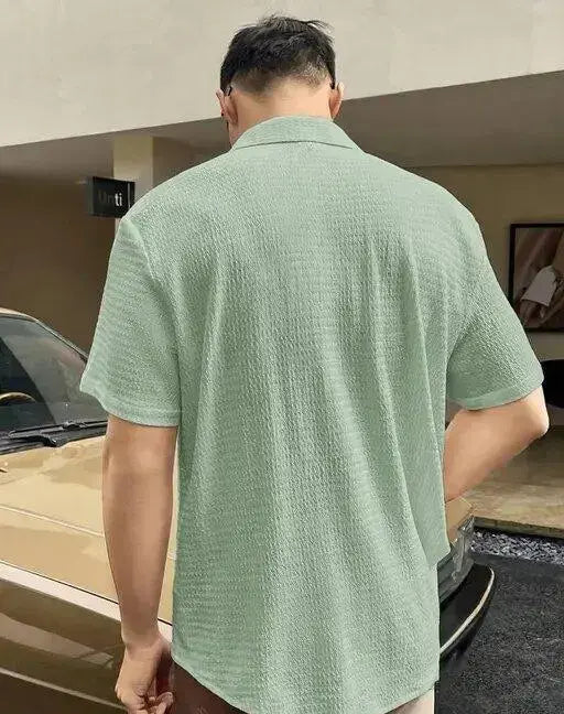Back view of a man wearing light green summer casual shirts for men from KN Enterprises